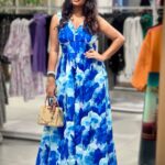 A Blue Orchid cotton v neck back knotted and back less sleeve less front button full length blue and light blue floral one piece dress